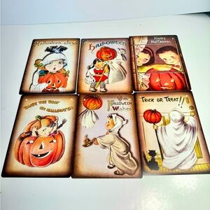 Six paper cardboard Halloween signs featuring vintage style retro sartwork.